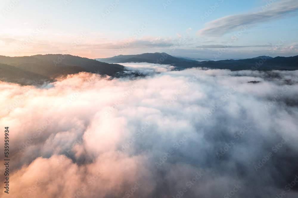 fog with mountains and light in the morning