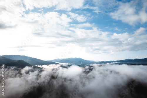 fog with mountains and light in the morning