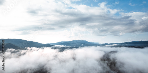 fog with mountains and light in the morning