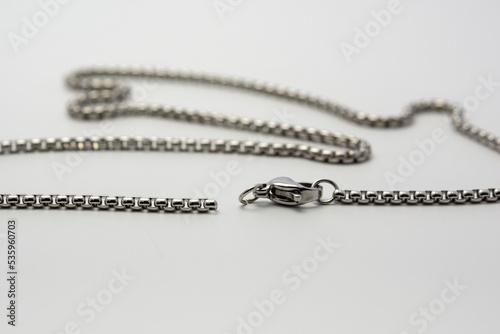 silver stainless steel necklace with hooks on a white background