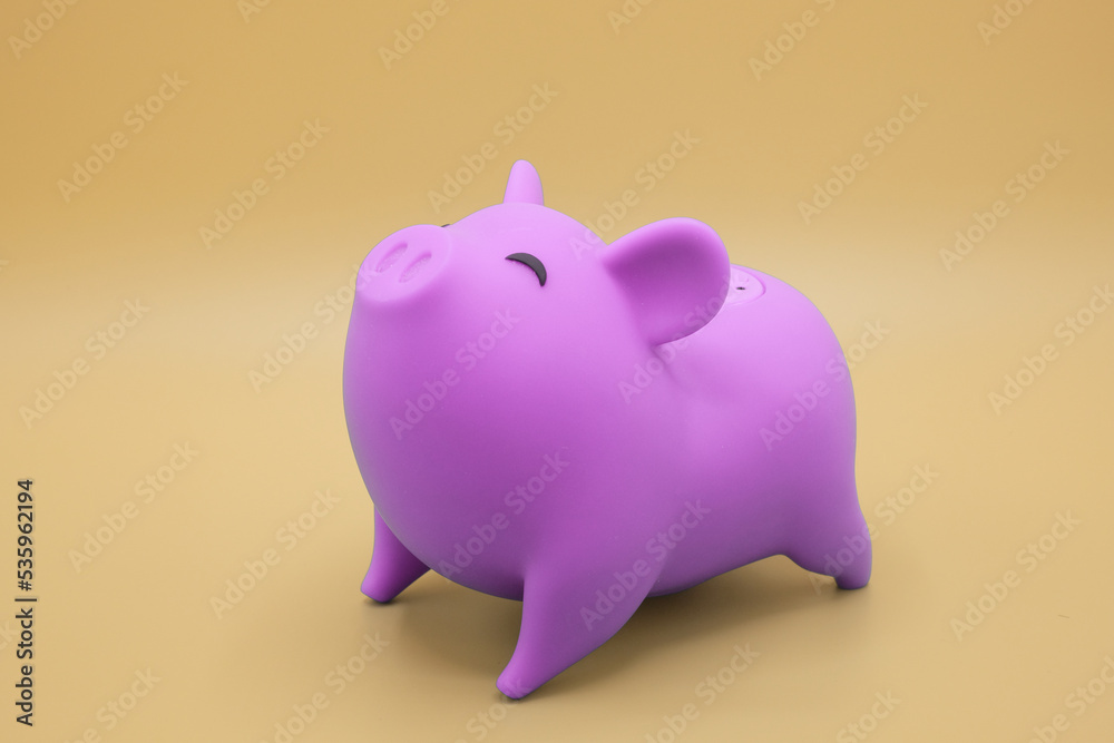 Piggy bank on yellow background. Finance, saving money concept.