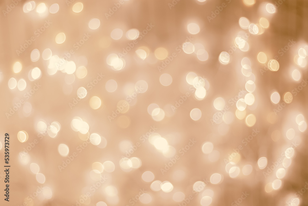 Defocused abstract bokeh background beige pastel colored flare