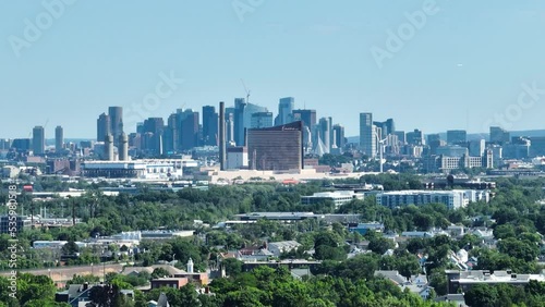 Aerial shot approaching Summer Boston skyline, plane flying through photo