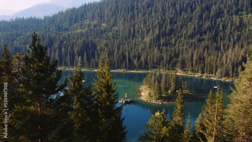 Panoramic View of Lake Caumasee Switzerland in Sunny Morning at Summer Season, Turquoise Water Surrounded by Wild Nature Landscape Mountains and Trees, Tilt Up Shot from Top of Mountain Panoramic View of Lake Caumasee Switzerland in Sunny Morning at Summer Season, Turquoise Water Surrounded by Wild Nature Landscape Mountains and Trees, Tilt Up Shot from Top of Mountain