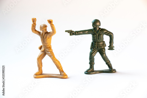 Two toy soldiers fighting conceptual photo