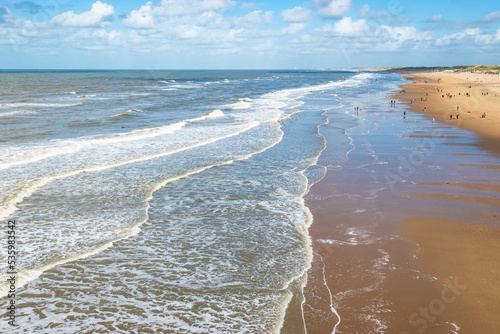 Fototapeta Naklejka Na Ścianę i Meble -  Beach with waves, Scheveningen coastline, North Sea, The Netherlands.