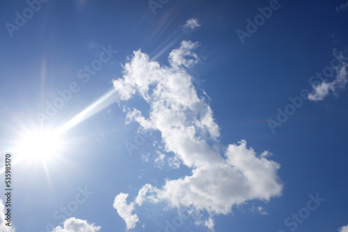 Blue sky with white clouds. Sky background.