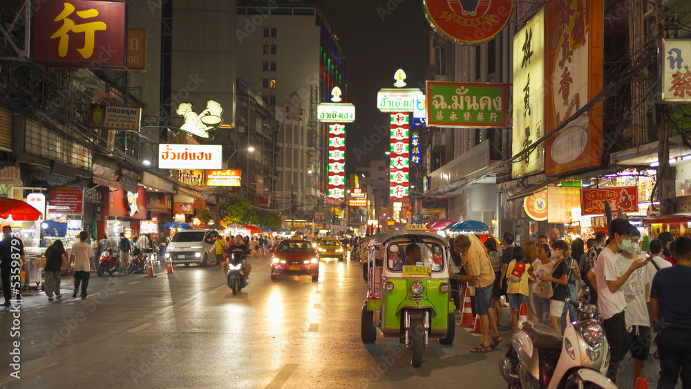 Night market at Yaowarat road, Bangkok City, Thailand. The famous tourist attraction with full of advertising Chinese signs. Cars of tourists people with billboard. China town. Walking street. - obrazy, fototapety, plakaty 