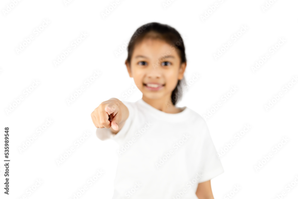 Young Asian girl wear a white T-shirt stands with her right hand pointing forward with clipping path. Young Asian girl wear a white T-shirt stands with her right hand pointing forward with clipping path.