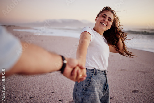 Photography Pov, couple and holding hands on beach, sand and happy together, relax and smile on holiday, vacation and trip
