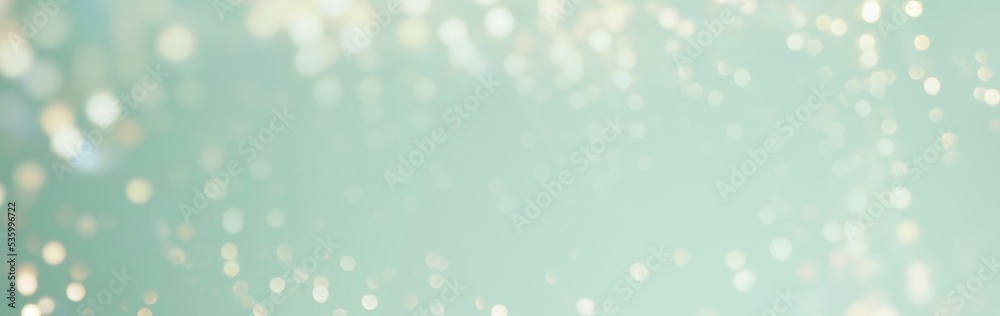 Fototapeta premium Christmas background banner with golden bokeh lights - festive gold green xmas and new year banner, header with copy space 