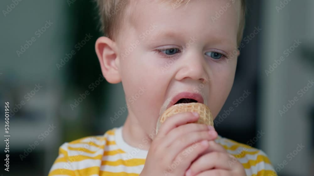 Kid Watching Cartoons On Tablet. Grimy, Eats Ice Cream Kid Watching Cartoons On Tablet. Grimy, Eats Ice Cream