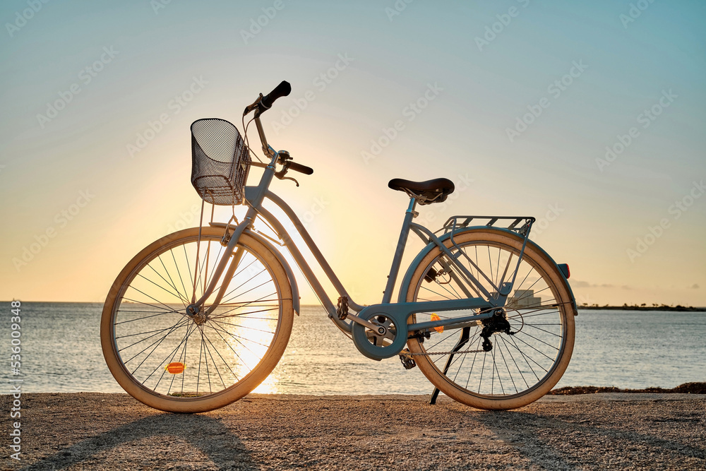 Fototapeta premium Bicycle parked on the seaside promenade on beach