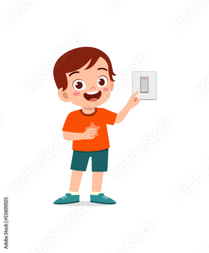 little kid press electric power switch on the wall