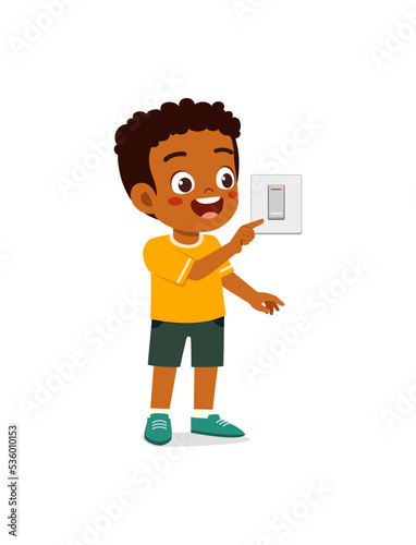 little kid press electric power switch on the wall