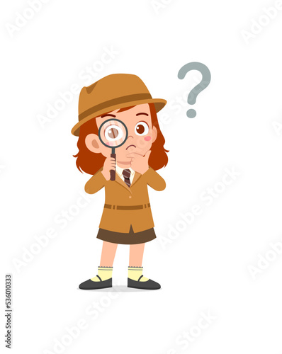 little kid wearing detective costume and holding magnifying glass