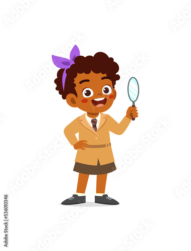 little kid wearing detective costume and holding magnifying glass