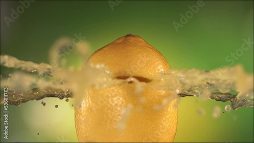 Half Lemon falling and splashing on white background. Food levitation concept. Slow Motion photo