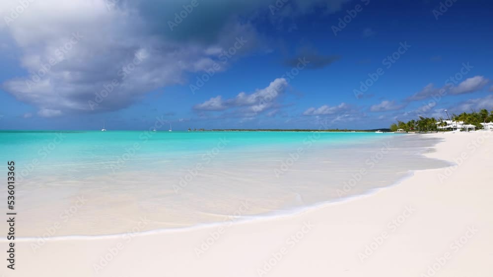 A tropical paradise beach in the Caribbean with fine sand and turquoise sea as a background A tropical paradise beach in the Caribbean with fine sand and turquoise sea as a background