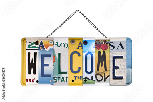 Welcome sign created with used recycled license plates isolated on trnasparent background