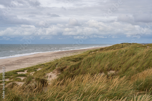 North sea at nymindegab strand near the ringkøbing fjord with dunes at high tide
