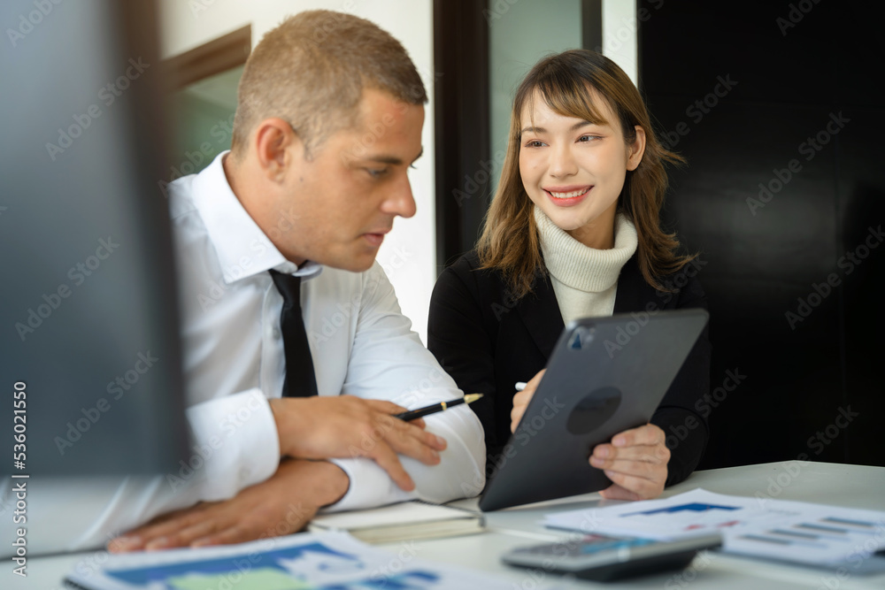 Businessmen write project ideas and use laptops to edit papers for brainstorming sessions with partners in the office. Businessmen write project ideas and use laptops to edit papers for brainstorming sessions with partners in the office.