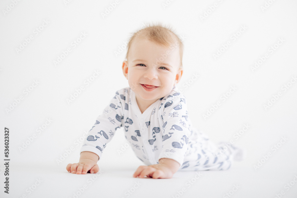 Portrait of cute smiling and lying baby boy in romper. Portrait of cute smiling and lying baby boy in romper.