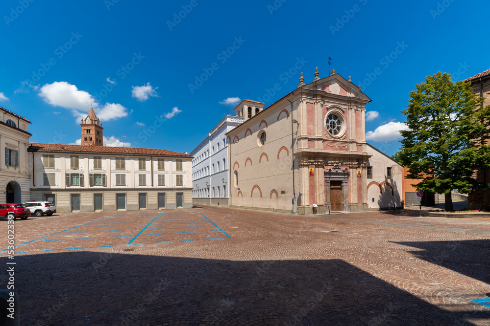 Alba, Langhe, Piedmont, Italy - August 16, 2022: Vittorio Veneto square with the church of Santa Caterina (18th century) in the background the bell tower of San Lorenzo