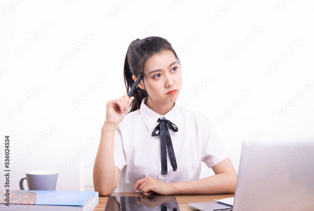 Asian female students taking an online class against a white background Asian female students taking an online class against a white background