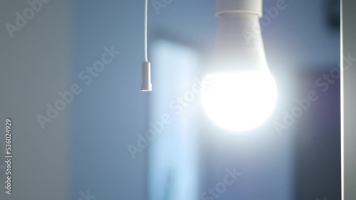 Girl Turn On the Light in a Dark Room, Woman Turning the Light On a Led Bulb, Turns the Light On at Home, Pull Switch On Off 
