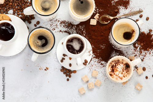 Coffee cup assortment on light background.