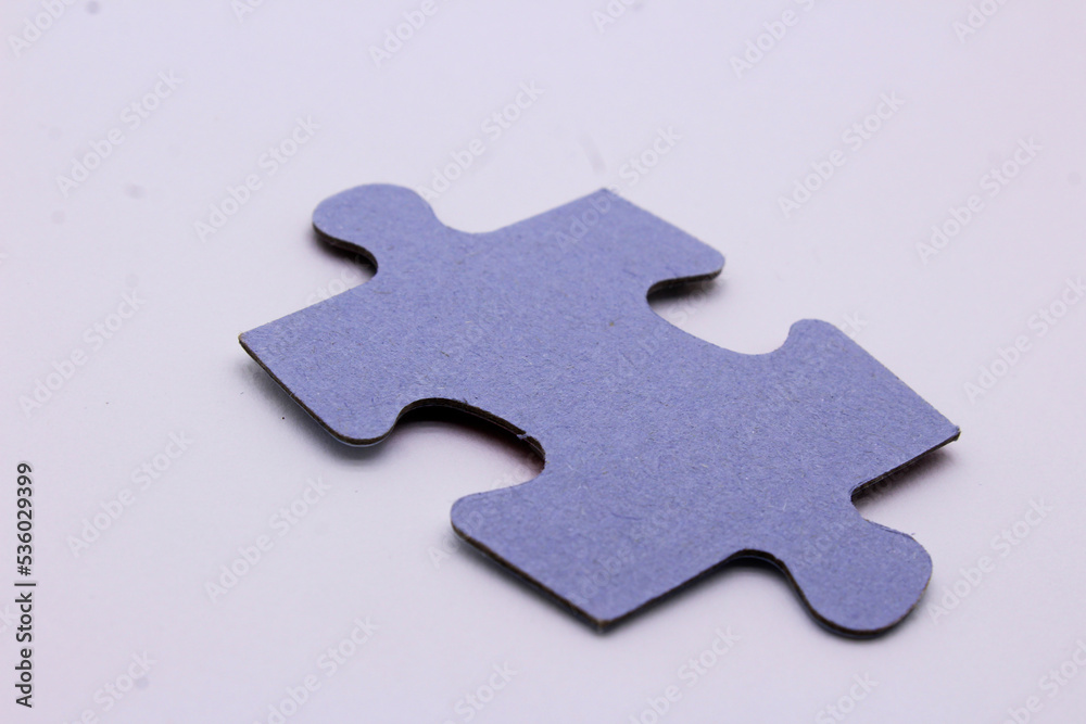 Fototapeta premium a piece of a puzzle on a white puzzle background