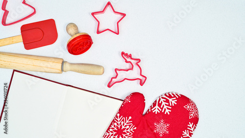 Book for recipes and cooking tools on white background. Flat lay