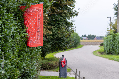 Tela Red farmer handkerchief and flag as a farmers protests symbol in Belgiumin front of a farm
