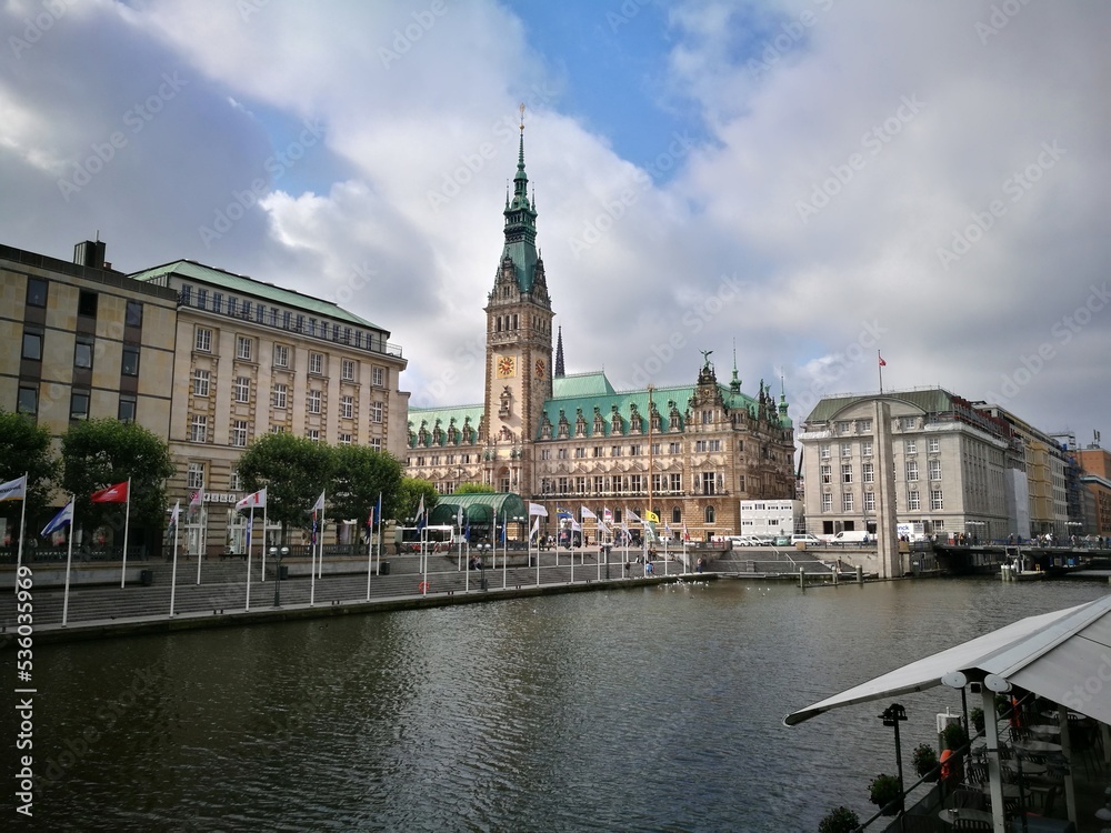 Hamburg, Germany: view of the Kleine Alster canal and Hamburg City Hall (Hamburger Rathaus), from Alsterarkaden