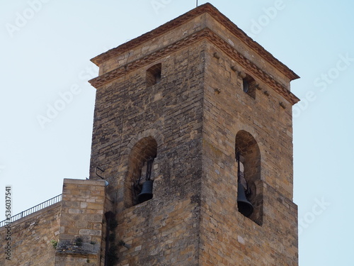 torre campanario románica de la iglesia de valdeflores en el castillo de benabarre, planta cuadrada, dos cornisas ajedrezadas, arcos de medio punto con dos campanas, huesca, españa, europa  photo