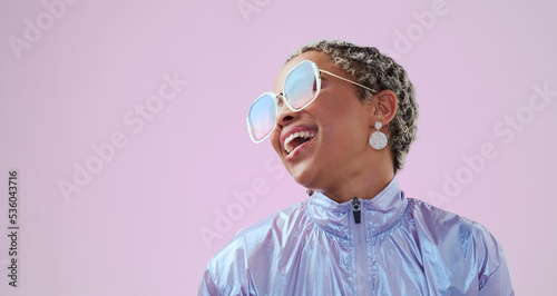 Happy black woman, beauty and fashion sunglasses, retro and cool vintage look. Model, female and unique style, costume or designer jacket outfit and jewelry isolated on pink studio mockup background. © Nicholas Felix/peopleimages.com