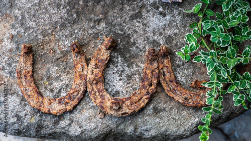 Garden decorations made of stones and stone sculptures among nice greens.