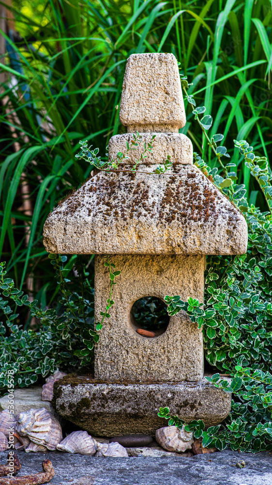 Garden decorations made of stones and stone sculptures among nice greens. Garden decorations made of stones and stone sculptures among nice greens.