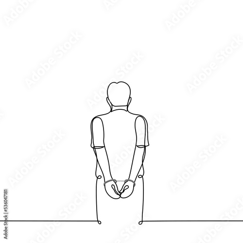 man stands with his back to the viewer in handcuffs behind his back - one line drawing vector. concept prisoner, hostage, arrested