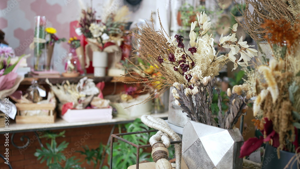 Obraz premium Flower shop interior. Closeup of elegant bouquet arrangement with diverse colors. Small business concept
