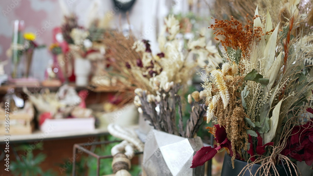 Flower shop interior. Closeup of elegant bouquet arrangement with diverse colors. Small business concept
