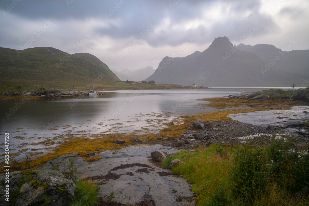 mountain landscape in the fiords of Lofoten islands on a foggy day, Norway