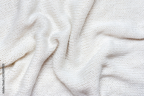 White macro photo of textured jersey and knitting of sweater or sweatshirt. Pattern and background for fashion Warm Autumn concept