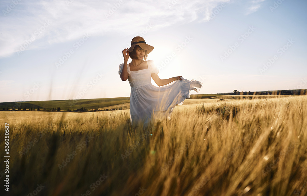 Nice landscape. Beautiful young bride in white dress is on the agricultural field at sunny day Nice landscape. Beautiful young bride in white dress is on the agricultural field at sunny day