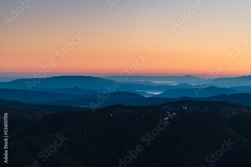 silhouette of mountains at sunrise