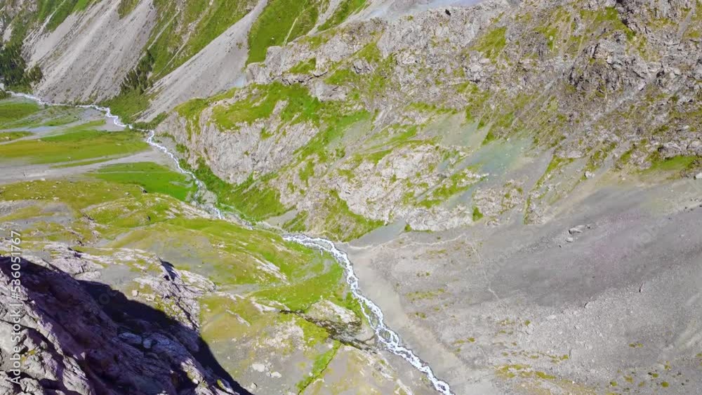 Lake Alakol in the glacial mountains of Kyrgyzstan. Drone flight over a magnificent mountain lake in the mountains of Central Asia Lake Alakol in the glacial mountains of Kyrgyzstan. Drone flight over a magnificent mountain lake in the mountains of Central Asia