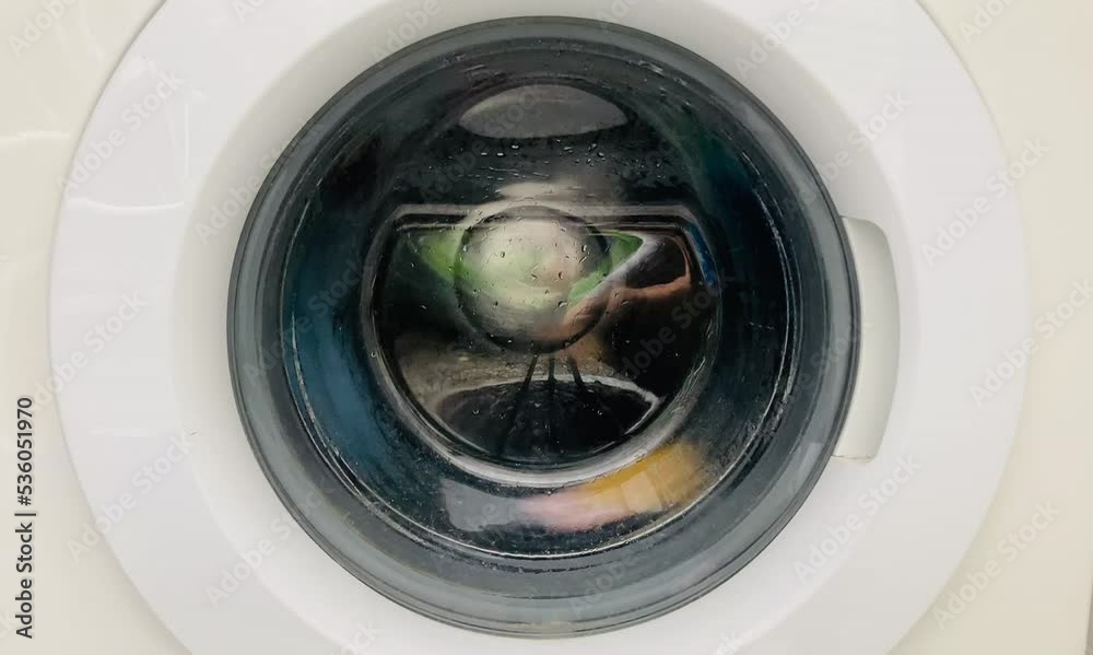washing machine spinning in the laundromat washing machine spinning in the laundromat