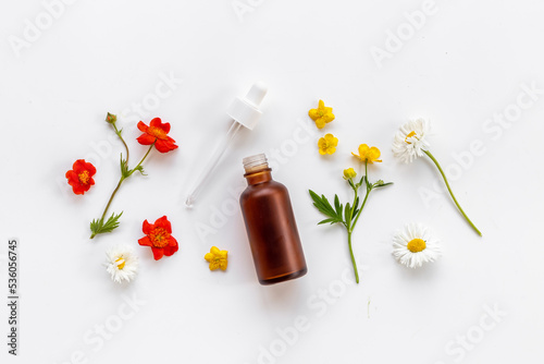 Cosmetic bottle with pipette and medicinal herbs essential oil