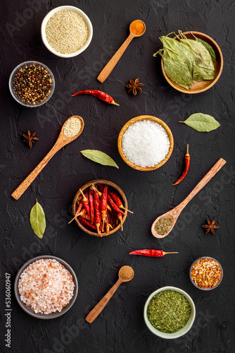 Powdered spices and herbs in bowls. Colorful cooking background